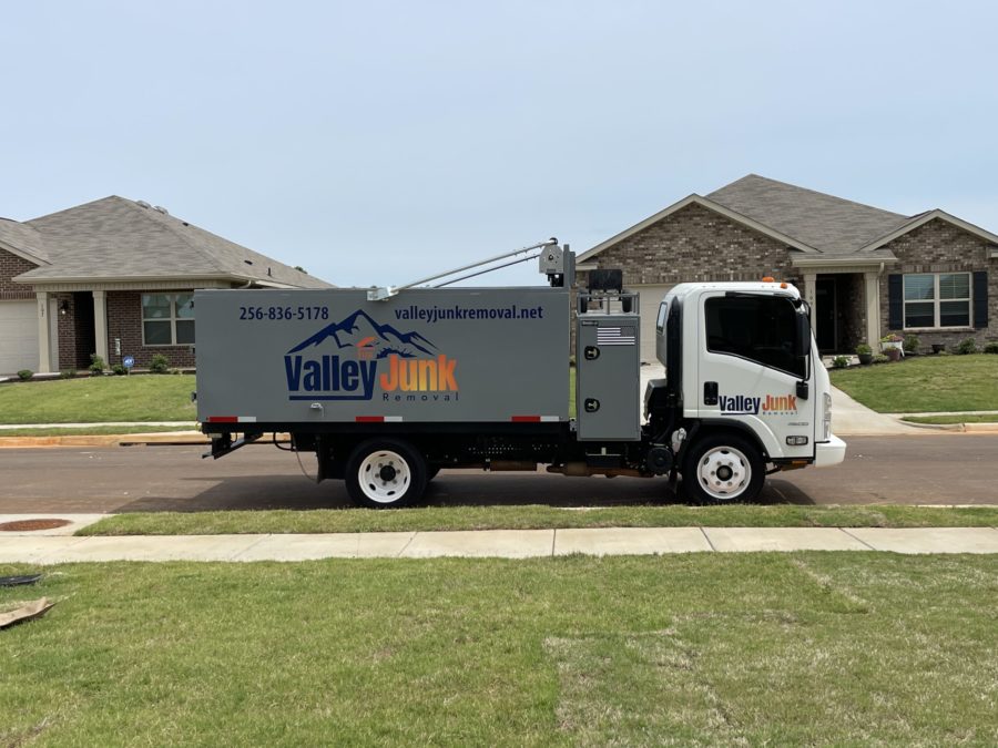 Valley Junk Removal Truck in Alabama, parked in street before removing junk from home