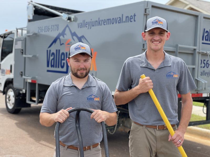 valley junk removal experts standing with equipment from truck for junk removal services