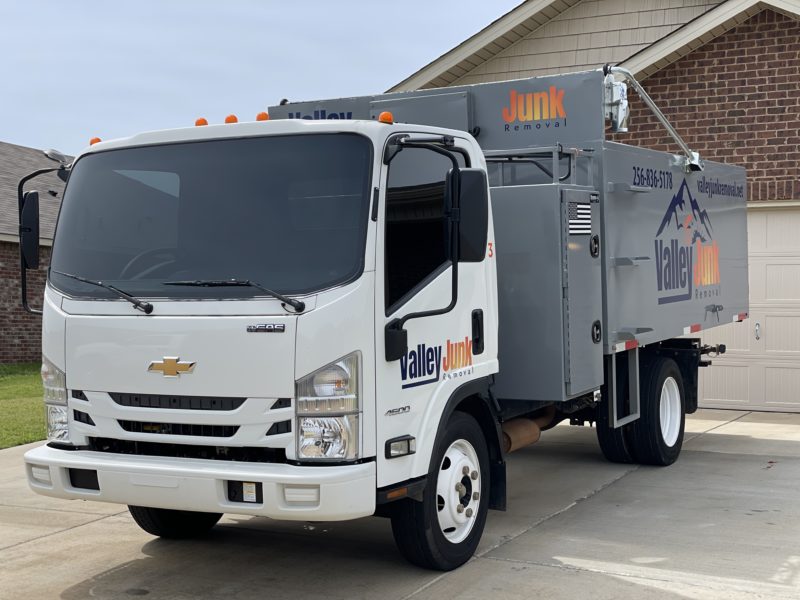 Valley Junk Removal truck parked outside a home in Brownsboro, AL